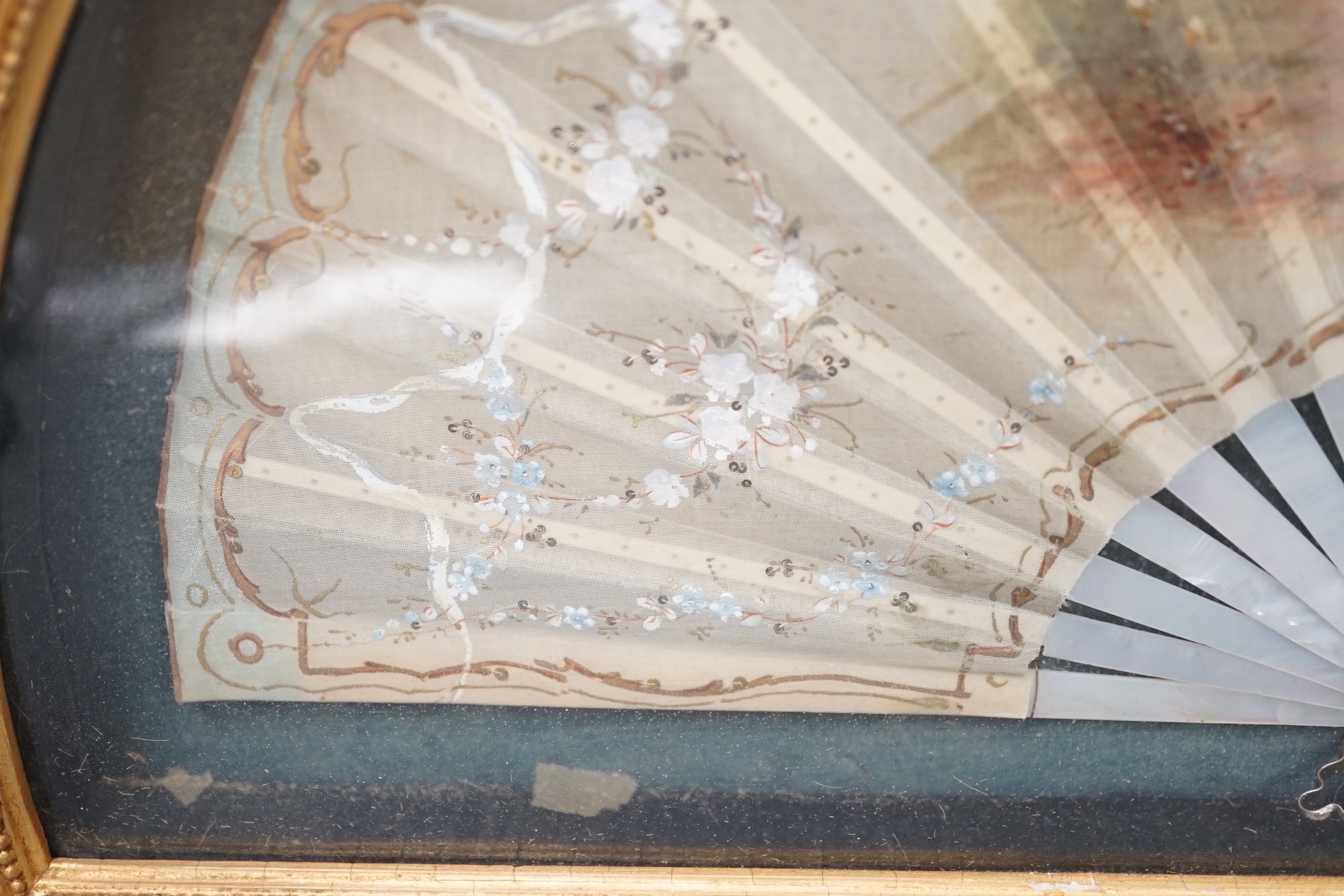 A framed Victorian figuratively painted fan with mother of pearl guards